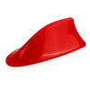 A bright red shark fin car antenna with FM/AM signal enhancement.