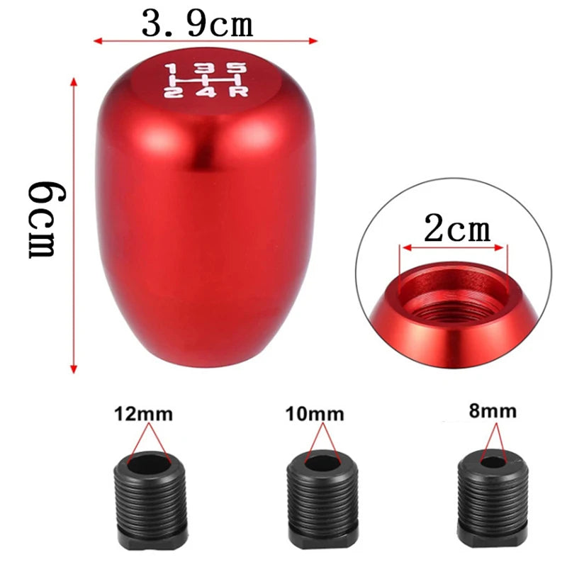 Red aluminum gear shift knob with adapters and various sized threaded adapters shown alongside.