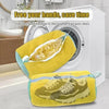 Yellow laundry bag with a mesh net inside, used to simulate hand washing for cleaning shoes.