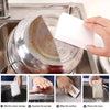 Demonstration of how to use multi-purpose magic cleaning sponges for effective kitchen cleaning.