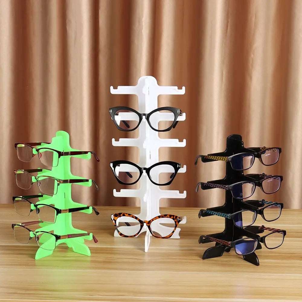 A display stand holding various pairs of eyeglasses and sunglasses in different colors and styles.