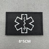 Black fabric patch featuring a white medical cross symbol with an IV drip design.