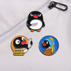 Black and white cartoon penguin enamel pin with a smiling expression