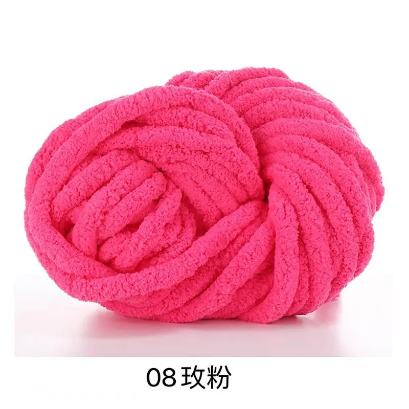 A ball of bright pink chunky acrylic yarn used for knitting and crochet
