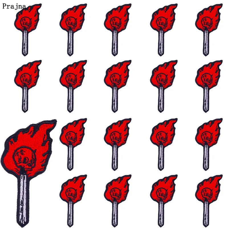 A set of ten embroidered iron-on patches featuring punk skull and horror designs in various colors.
