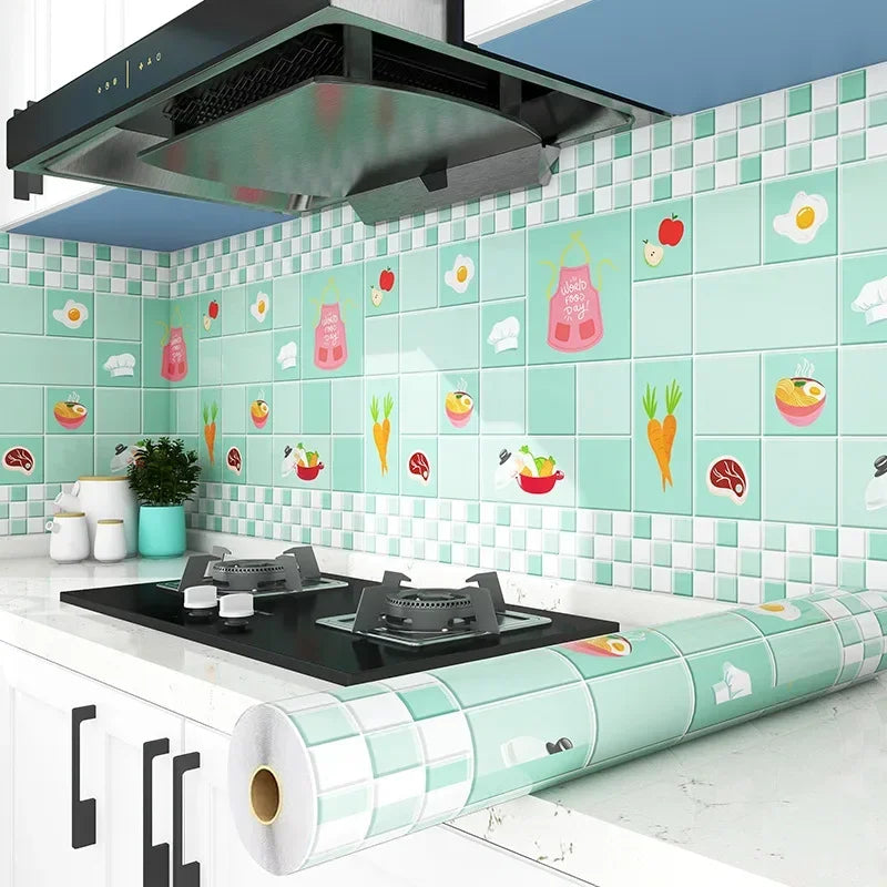 A kitchen splashback wall decorated with light green tiles featuring colorful food illustrations and a roll of self-adhesive 