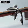 Black shark-design guitar capo with zinc alloy build shown on a wooden neck.