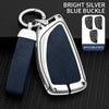 A bright silver blue buckle car key case with a leather strap and multiple keys displayed on a black background.