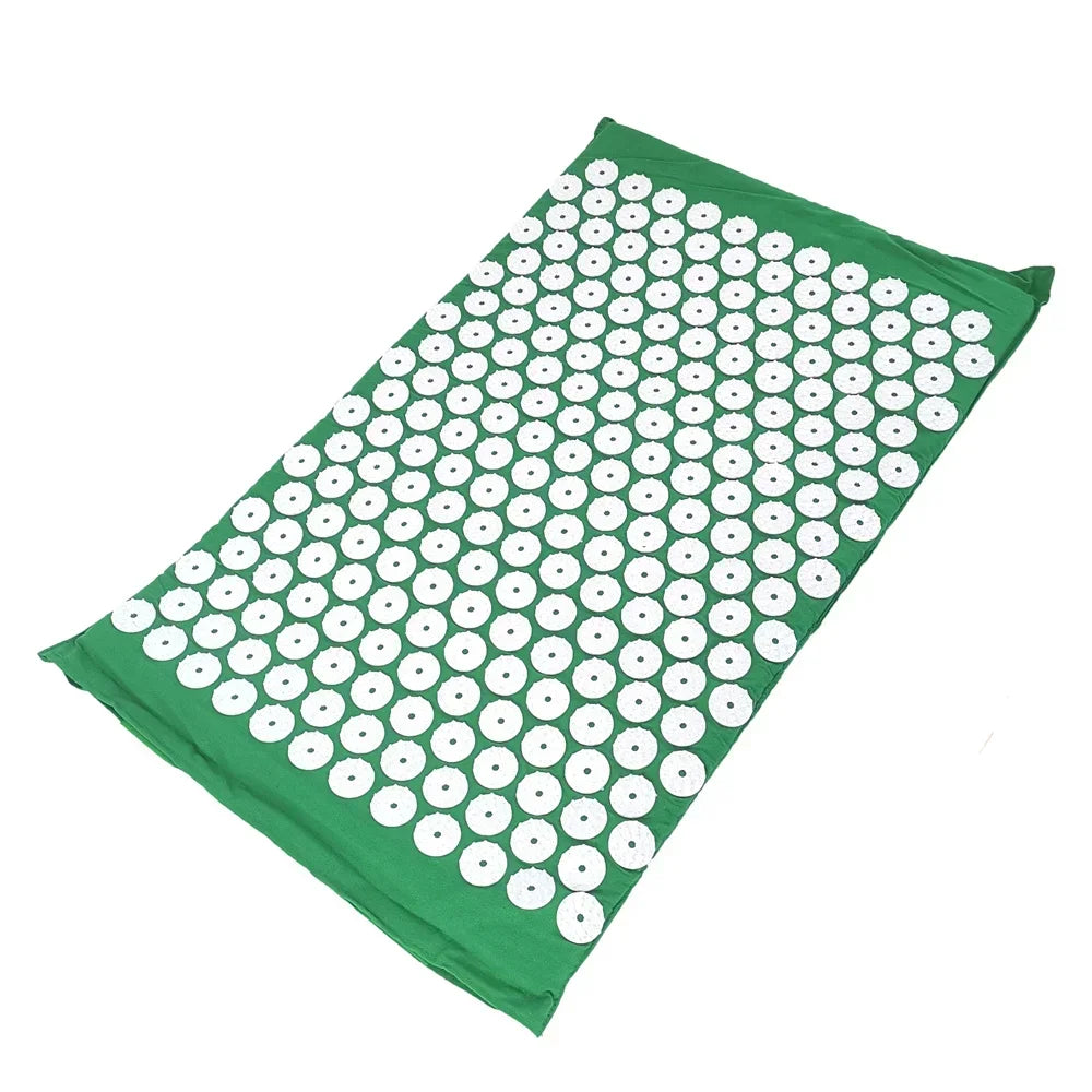A green acupressure mat with numerous white, circular bumps and a matching pillow.