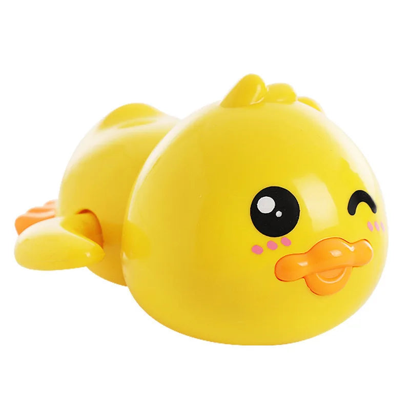A bright yellow wind-up bath toy duck with a smiling face and orange beak.