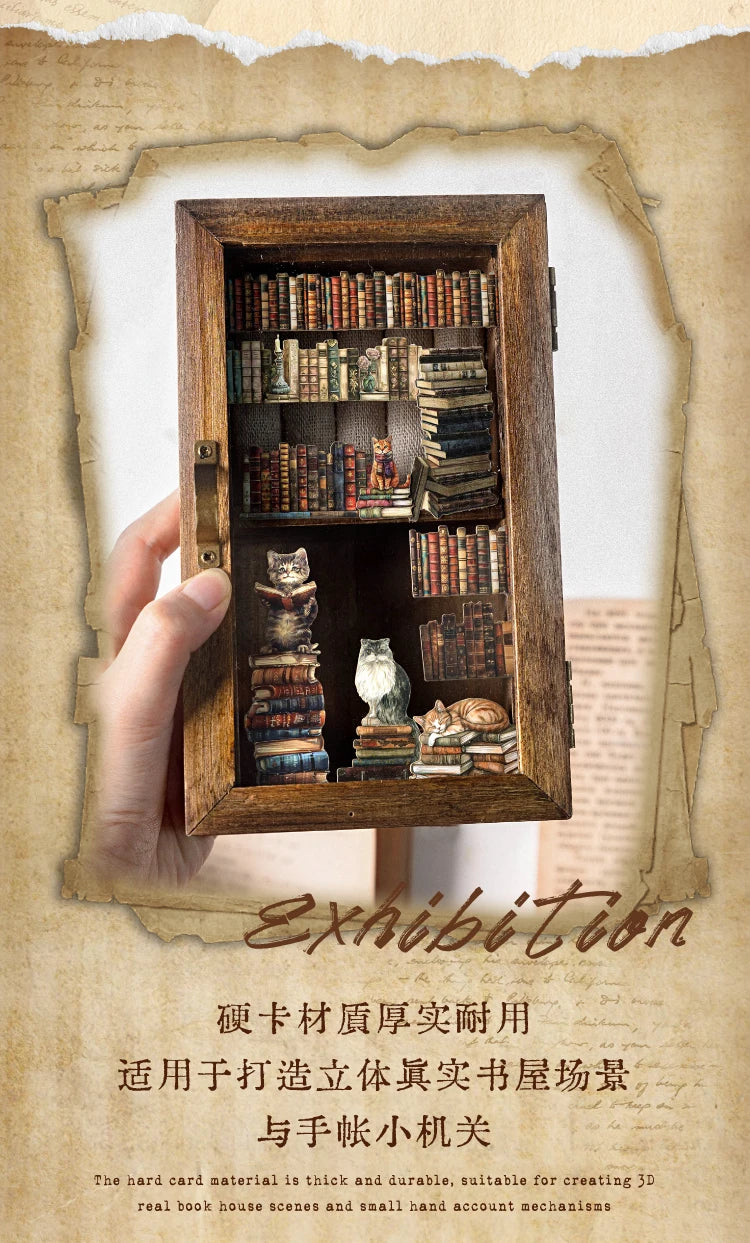 A wooden box displaying various die-cut stickers and small components for creating 3D relief scenes.