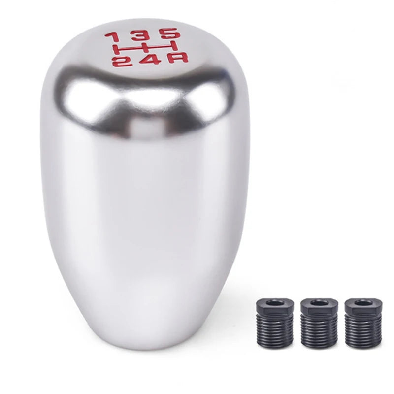 Silver aluminum gear shift knob with markings 135, 5, H, 24R and three adapter rings.