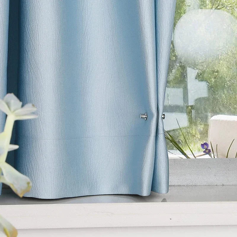 Light blue satin curtain fabric with silver magnetic clips and a detachable button fastener