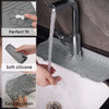 A silicone faucet drain mat is shown being used to protect a countertop while draining water.