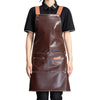 A brown leather apron with multiple pockets and leather straps worn over a black shirt.