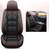 A brown leather universal car seat cover with black stitching and embossed design shown in a studio setting.