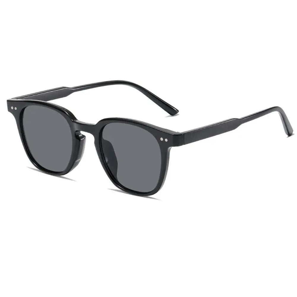 A pair of black vintage square sunglasses with dark lenses and a thin frame.