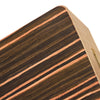 Close-up of a compact travel cajon drum with wood grain and adjustable strap detail.