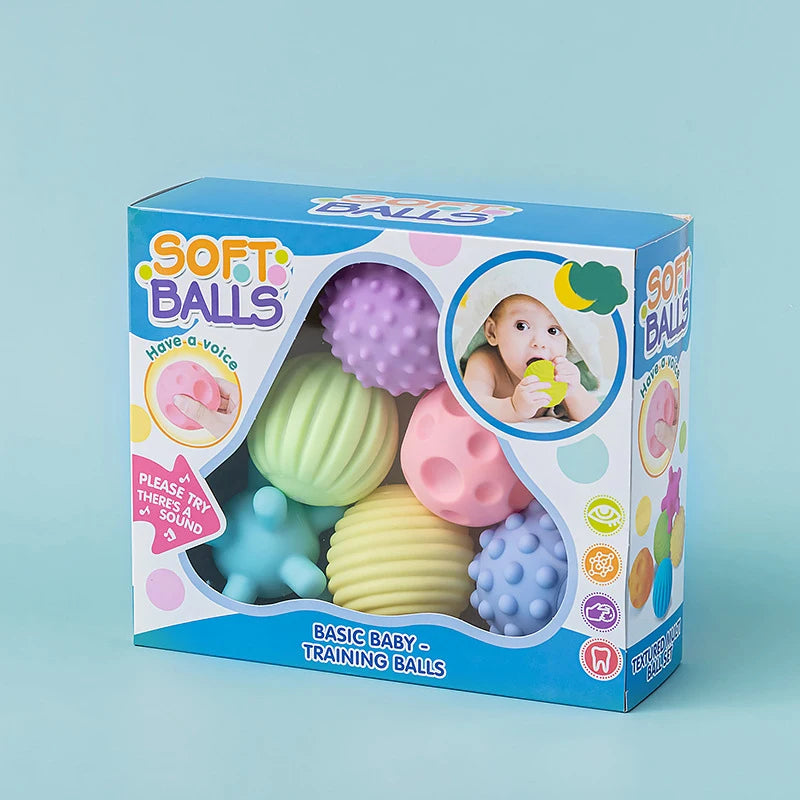 A box of Soft Balls for babies containing six colorful, textured training balls for sensory development.