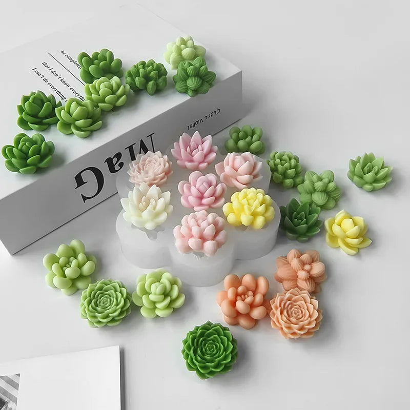 A collection of green and pink silicone succulent flower molds displayed on a white background.