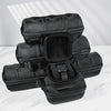 A stack of black portable leather watch travel cases with soft lining resting on a white marble surface.
