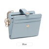 A light blue RFID shielded women's bi-fold credit card wallet with a gold chain attached.