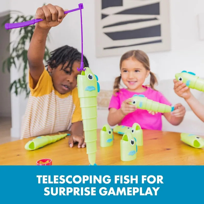 A child is using a telescoping fishing toy to play a surprise gameplay game with other toys on a wooden table.