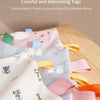 Colorful and interesting tags on a baby sensory comfort blanket for exercising hands, eyes, and brain coordination.