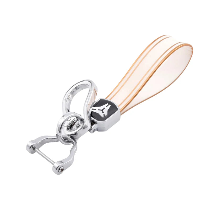 Silver key fob with a translucent pink and white TPU cover and a metal split ring.