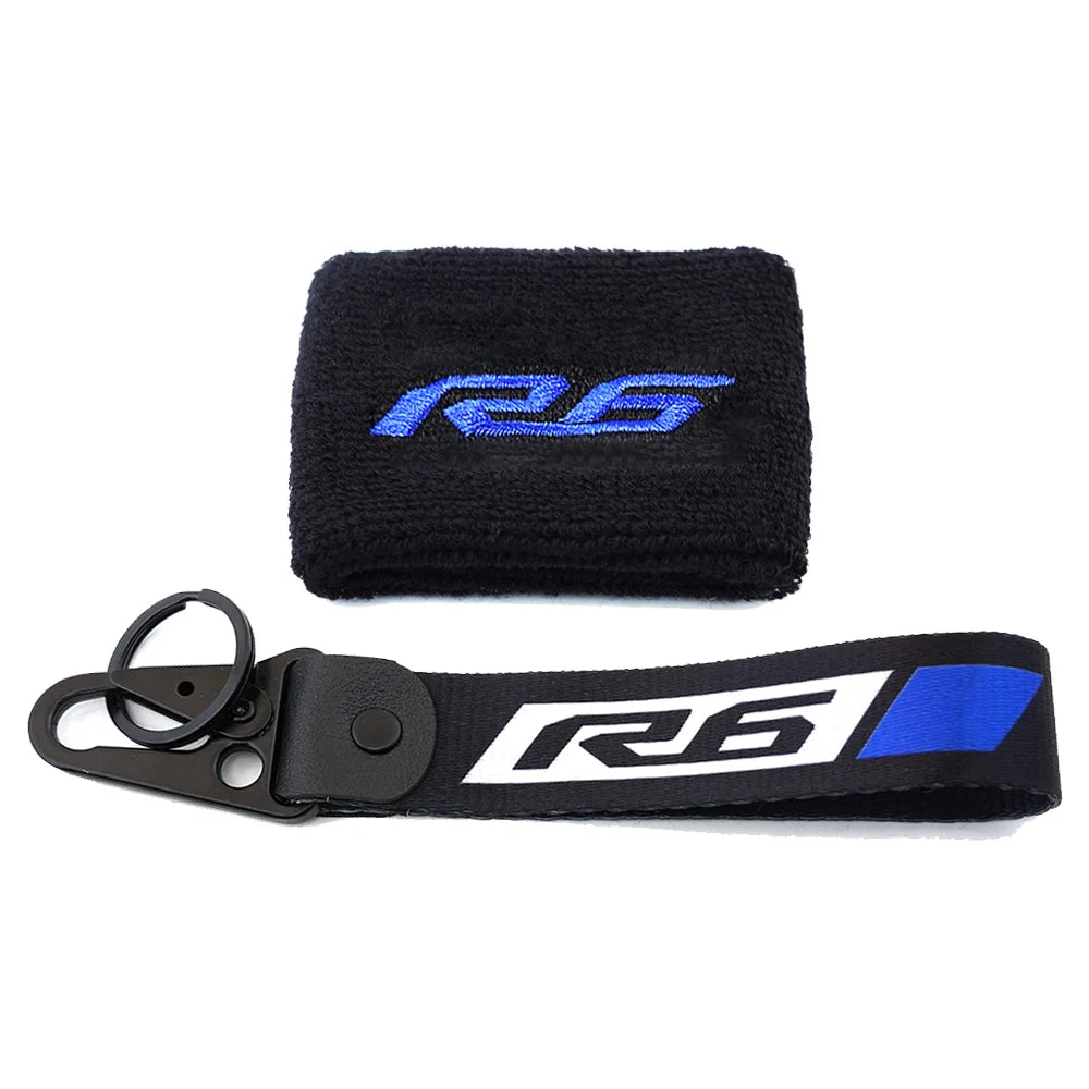 Black neoprene sock and strap with blue and white R6 logo for a brake fluid reservoir cover.