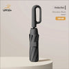A black automatic folding umbrella with a sturdy handle is shown against a light background.