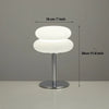 Modern cloud-shaped bedside lamp with a white diffused light and a silver stand.