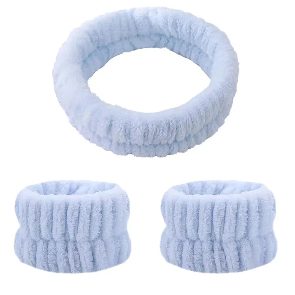 A set of light blue absorbent microfiber wrist washing bands or face-saving cuffs.