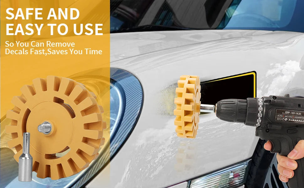 A hand uses a drill adapter to remove a decal from a car surface using a rubber eraser wheel.
