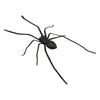 A realistic black spider used as a fridge magnet for funny prank decor.