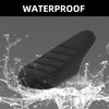 A black motorcycle seat cover is shown being splashed by water, demonstrating its waterproof property.