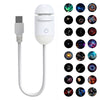 A white 2-in-1 mini galaxy star projector night light with a USB connector and multiple star patterns.