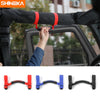 Close-up view of Jeep Wrangler grab handles with pull tabs mounted on an armrest for easy access.