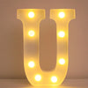 A glowing yellow LED letter night light shaped like the letter U, featuring multiple illuminated dots.