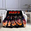 A black flannel throw blanket featuring a graphic print of the KISS band members in dynamic poses.