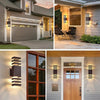 Modern up and down LED wall sconces illuminating a house exterior and front door.