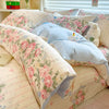 A lavender floral duvet cover set featuring pink roses and a white teddy bear pillow.