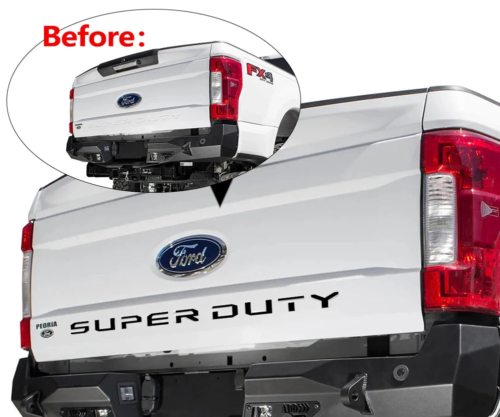 Close-up view of a Ford Super Duty truck tailgate with a decal being applied to the rear light area.