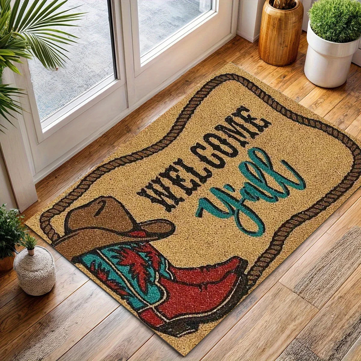 Spickriger Fußmatte mit der Aufschrift Welcome Yall und einer Stiefel-Design auf einem Holzfußboden.