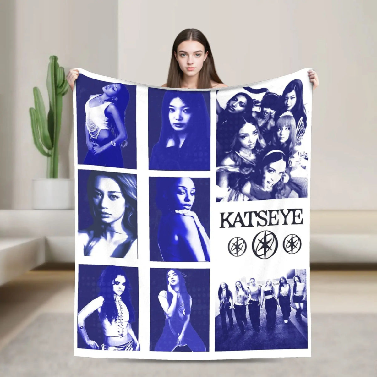 A dark blue blanket featuring a collage of portraits of female musicians and artists.