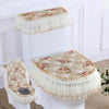 A set of antibacterial toilet seat covers featuring a floral pattern and ruffled edges on a white ceramic base.