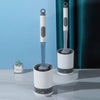 A white and gray refillable toilet brush set with a wall-mounted holder is displayed on a light surface.