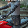 A person wearing a grey shirt and black gloves is mounting a red motorcycle with a black rider bag installed.