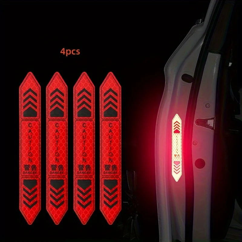 Four reflective warning stickers with caution and danger symbols displayed on a car door panel.