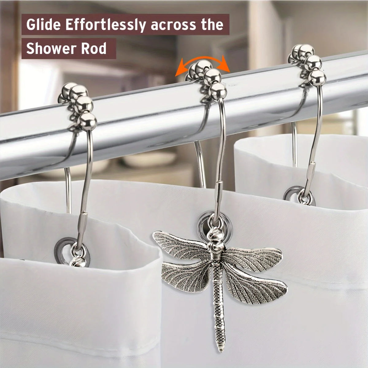 A set of rust-proof metal dragonfly shower curtain hooks gliding effortlessly across a shower rod.